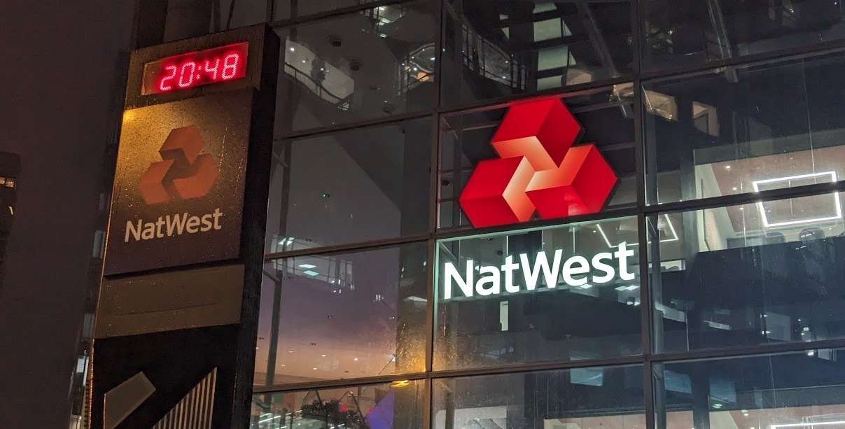 NatWest shares fall amid poor profit outlook and Farage report